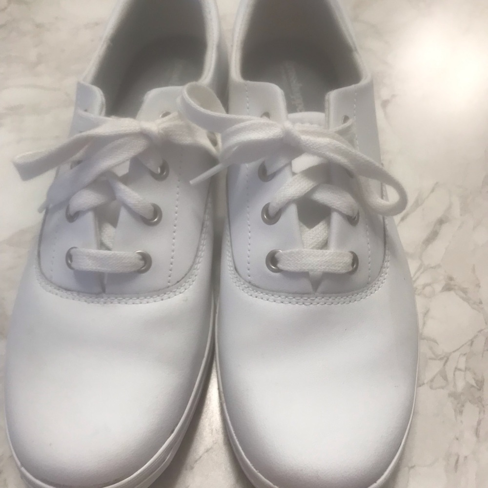 White leather tennis shoes.